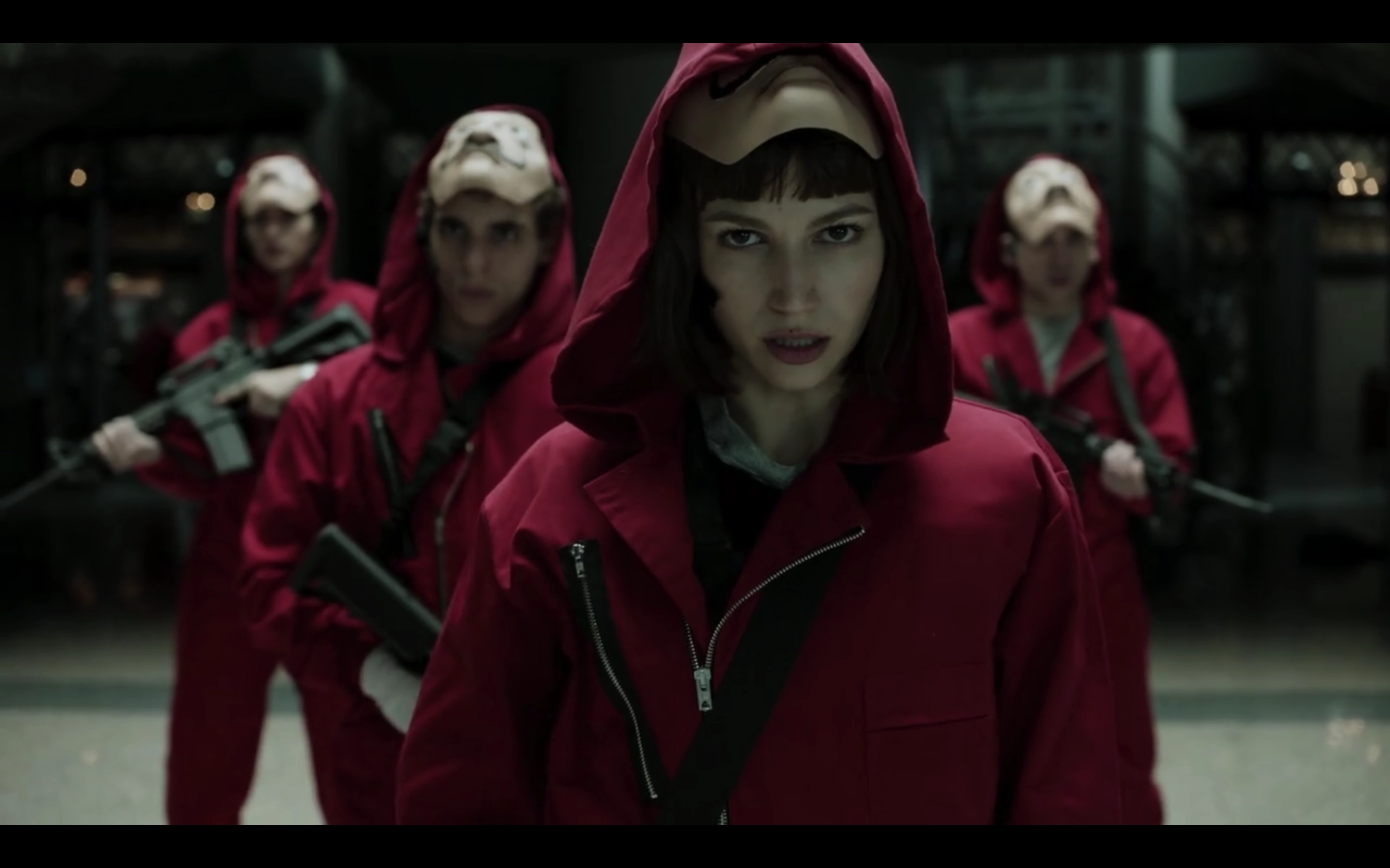 4 people with red uniform and mask