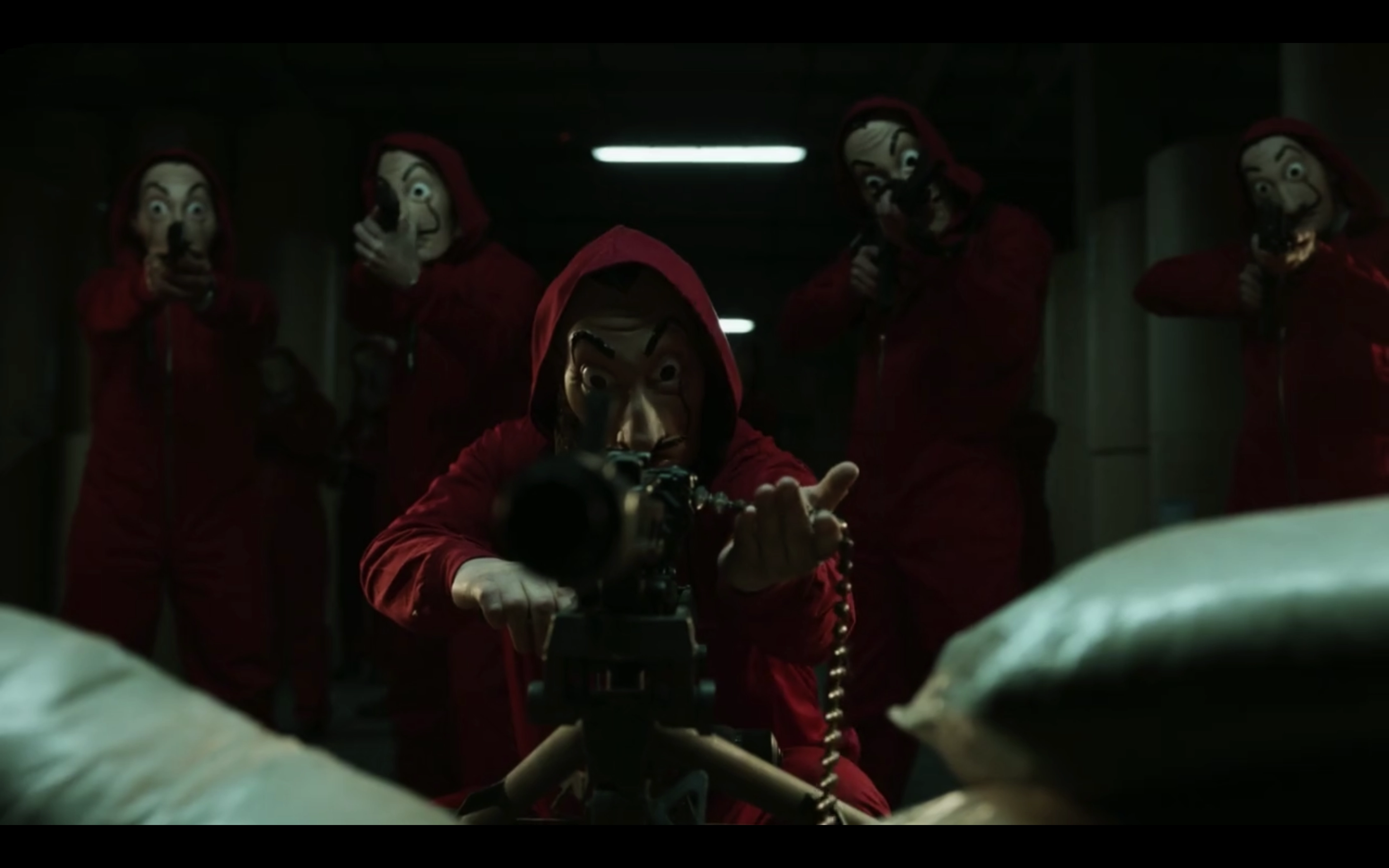 4 people with uniform and mask having guns in their hands