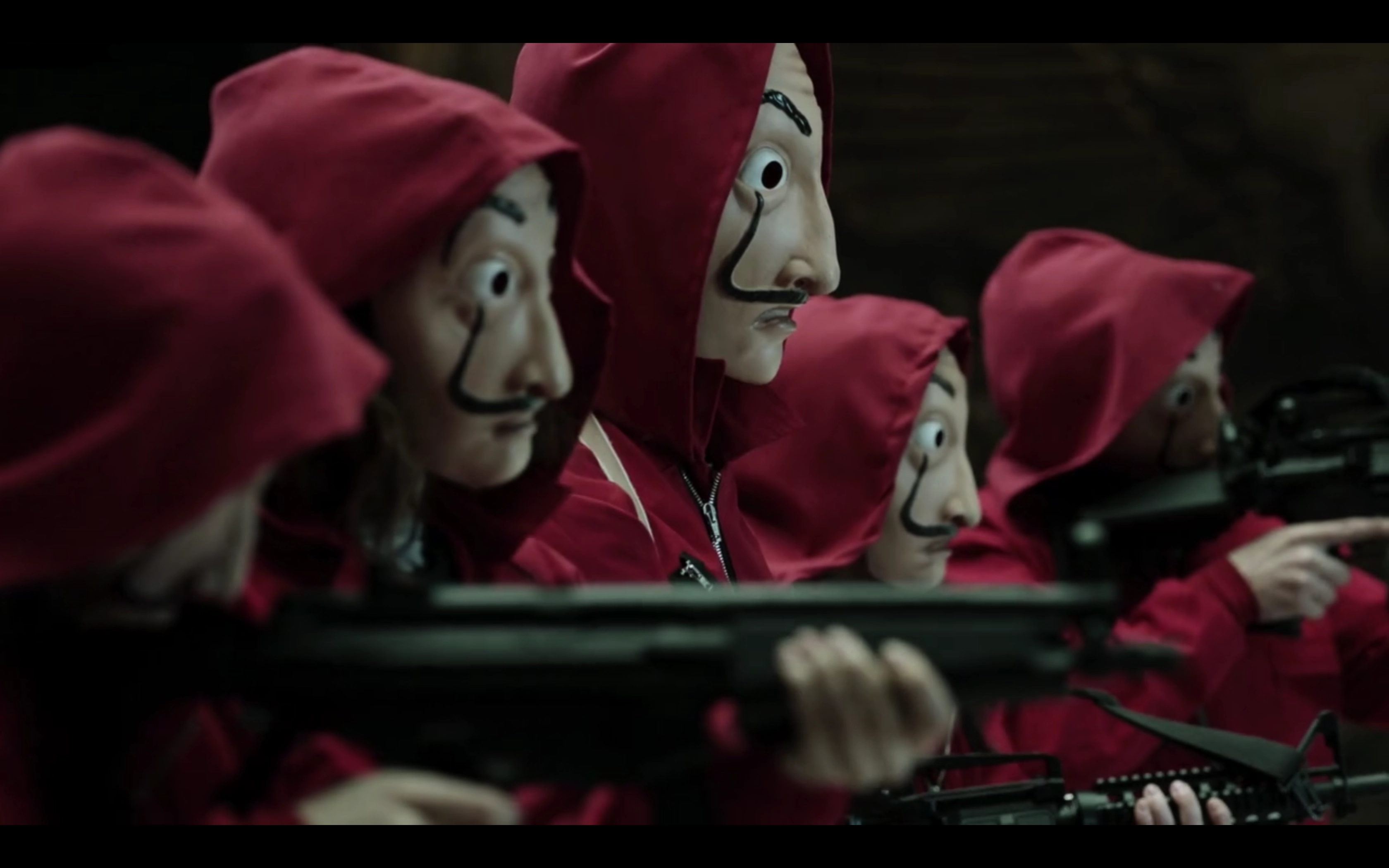 faces of people with mask and red uniform holding guns